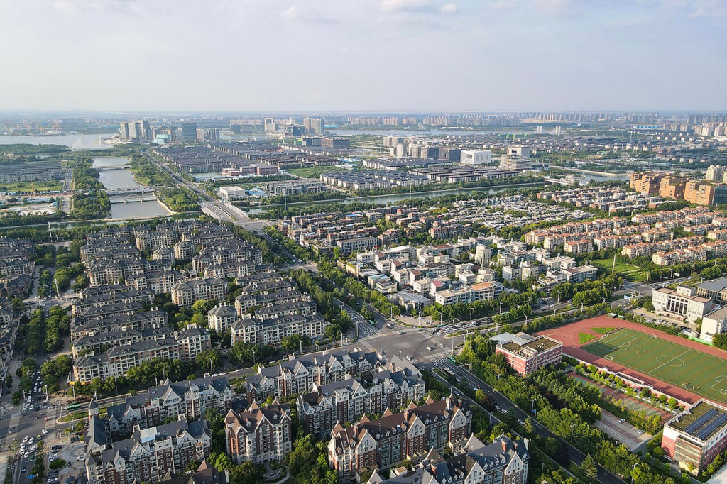 Aerial view of residential neighbourhoods in northern Zhengdong New Area, showing housing blocks and their surrounding urban layout