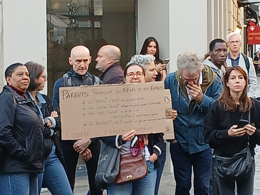 Why the Paris Protests Matter Beyond France: Education, Affordability and Trust 5 Parents expressing support for students during the October 2026 mobilisation outside Condorcet High School in Paris