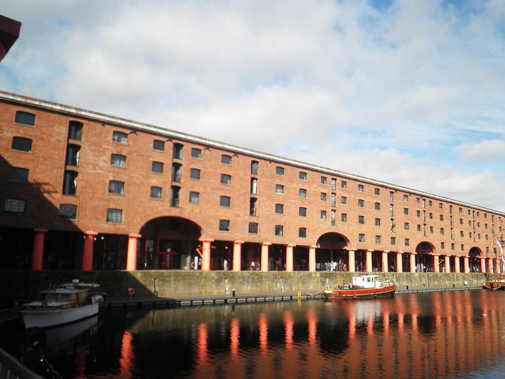 Save It or Demolish It? Who Decides Which Buildings Deserve a Future? 3 Historic brick warehouses and dockside architecture at Liverpool's Royal Albert Dock