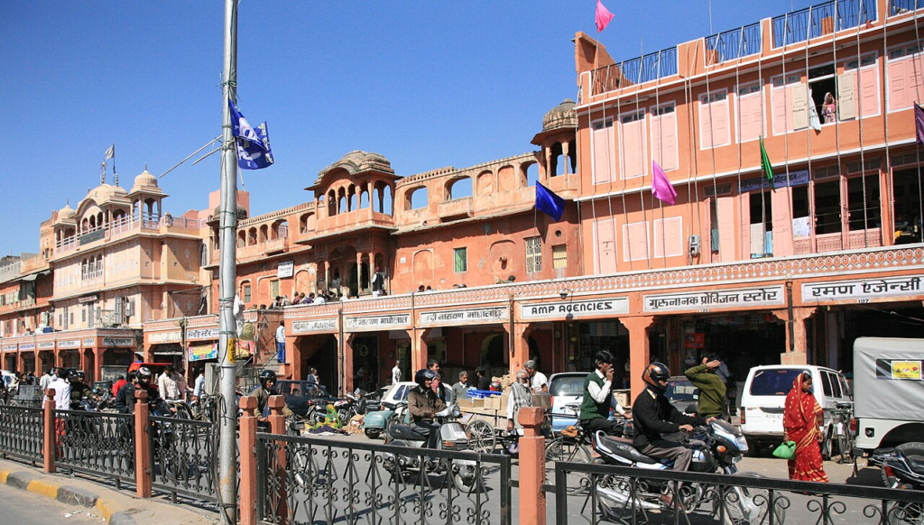 Save It or Demolish It? Who Decides Which Buildings Deserve a Future? 7 Continuous historic commercial façades, shops and everyday street activity along Tripolia Bazaar in Jaipur's walled city