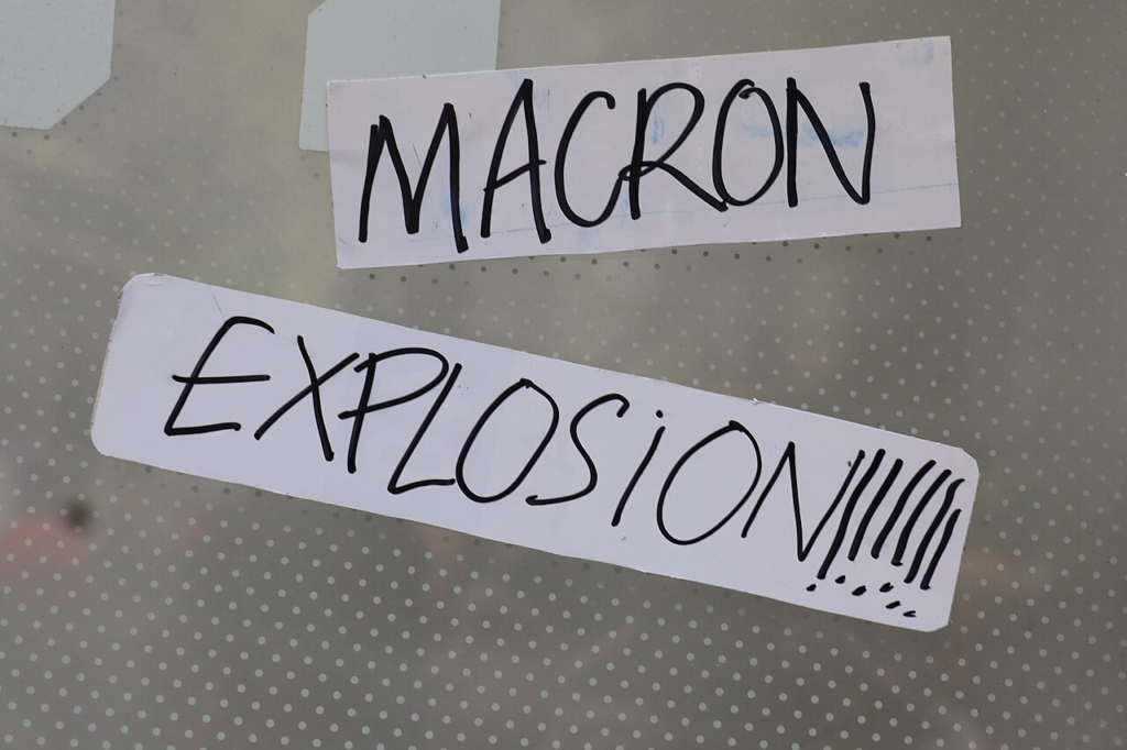 Why Is Paris Protesting? Schools, Living Costs and Public Anger Explained 5 Political protest messaging photographed during the Paris demonstration on 17 October 2026