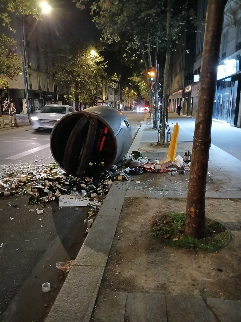 Why Is Paris Protesting? Schools, Living Costs and Public Anger Explained 6 A damaged waste container and debris on a Paris street following the October 2026 demonstrations