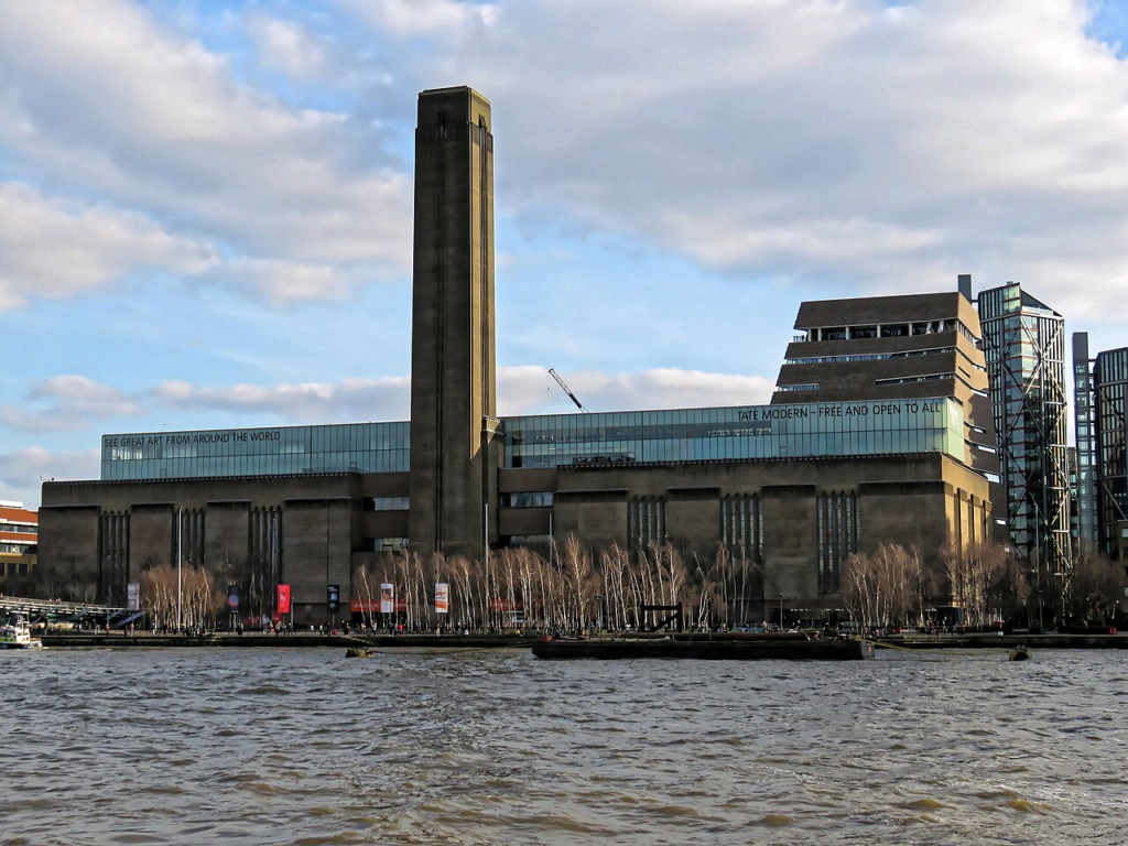 Save It or Demolish It? Who Decides Which Buildings Deserve a Future? 6 Tate Modern's retained industrial building and chimney on the River Thames, London