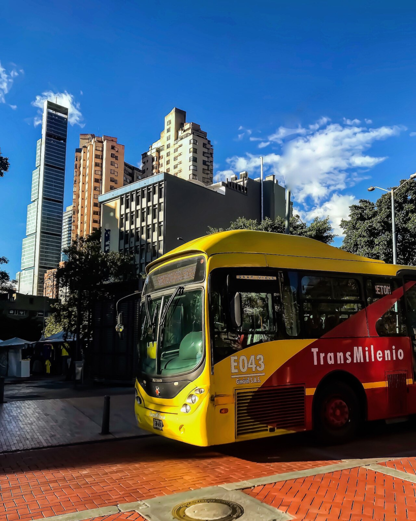 A TransMilenio bus operating on a Bogotá transport corridor, illustrating the journeys that form part of residential affordability