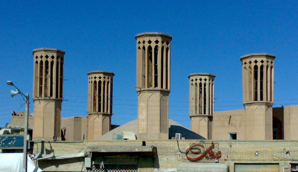 Traditional windcatchers rising above the urban fabric of Yazd, Iran