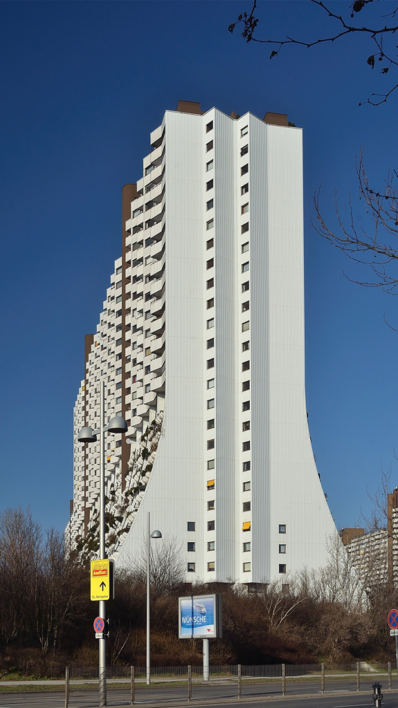 The residential façade and balconies of Wohnpark Alterlaa, Vienna, illustrating the relationship between dwelling design and everyday use