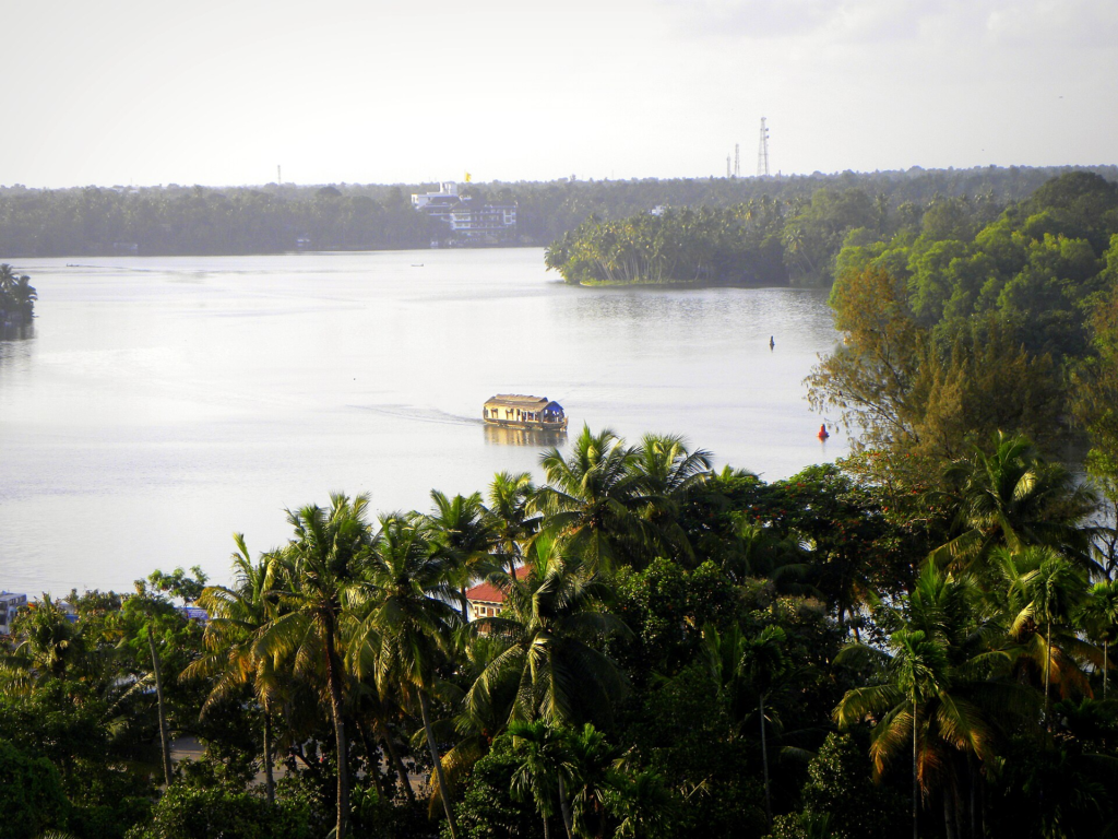 Aerial view of Ashtamudi’s waterbody, vegetated edges and adjacent settlement