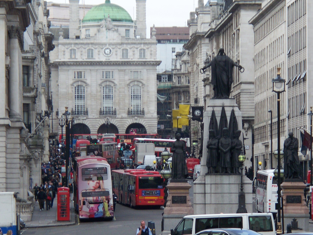 London buses operating amid dense central-city traffic at Piccadilly Circus