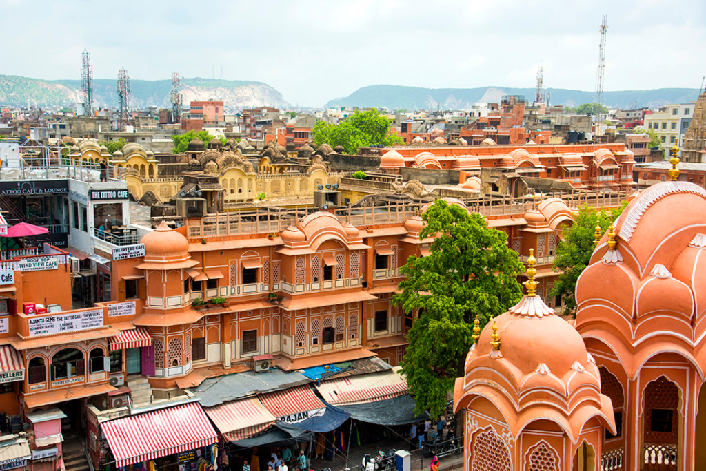 Historic Jaipur urban fabric showing commercial frontages, traditional architecture and the dense city beyond