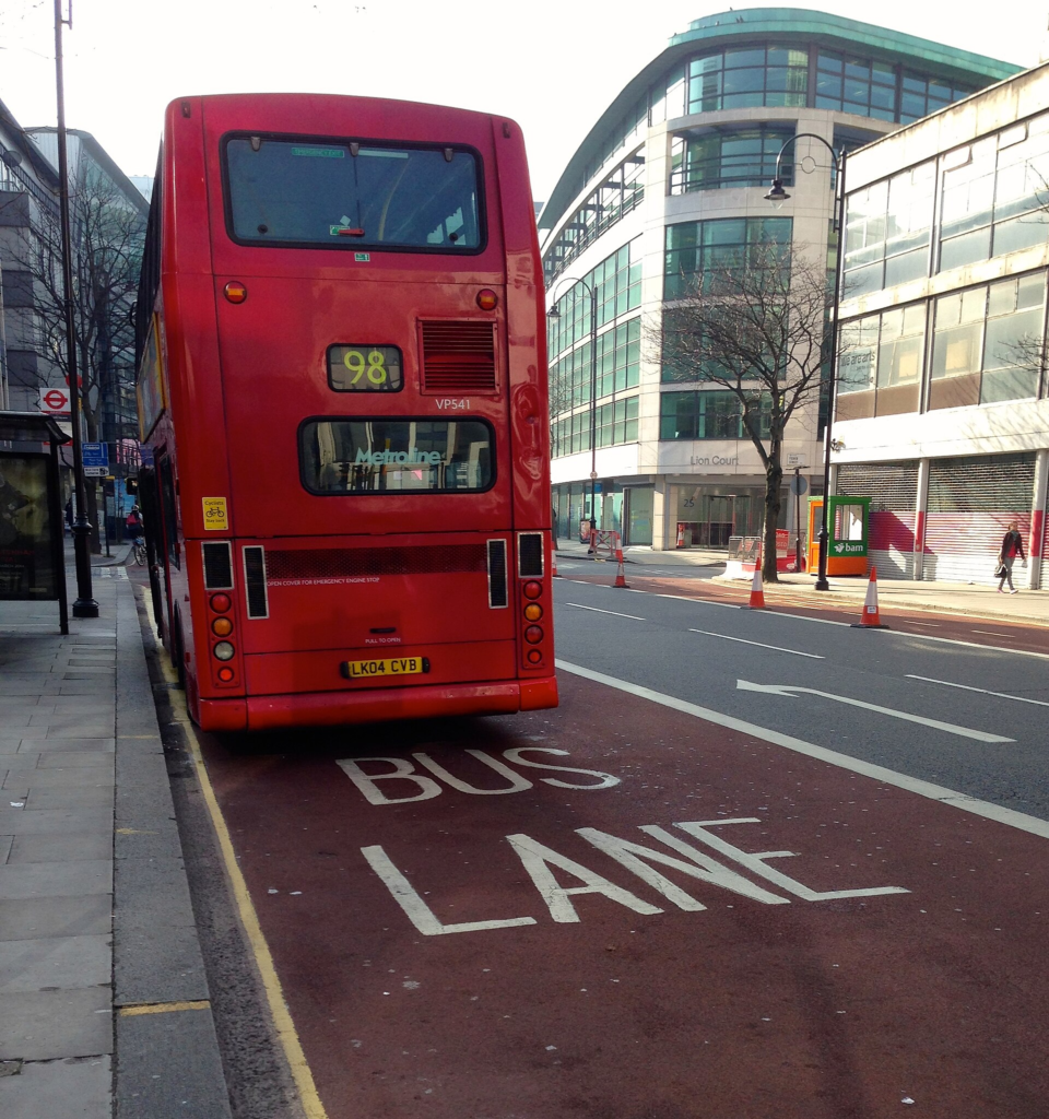 A London bus travelling in a clearly marked bus lane