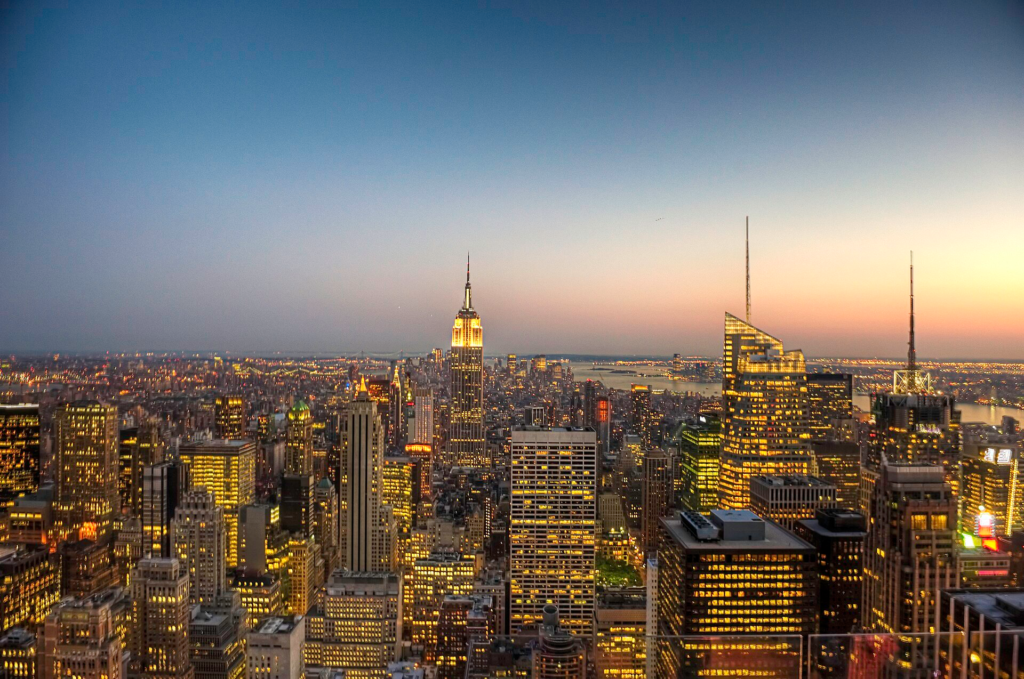 Evening Manhattan skyline, visually linking building operation, electricity demand and the carbon consequences of dense urban development