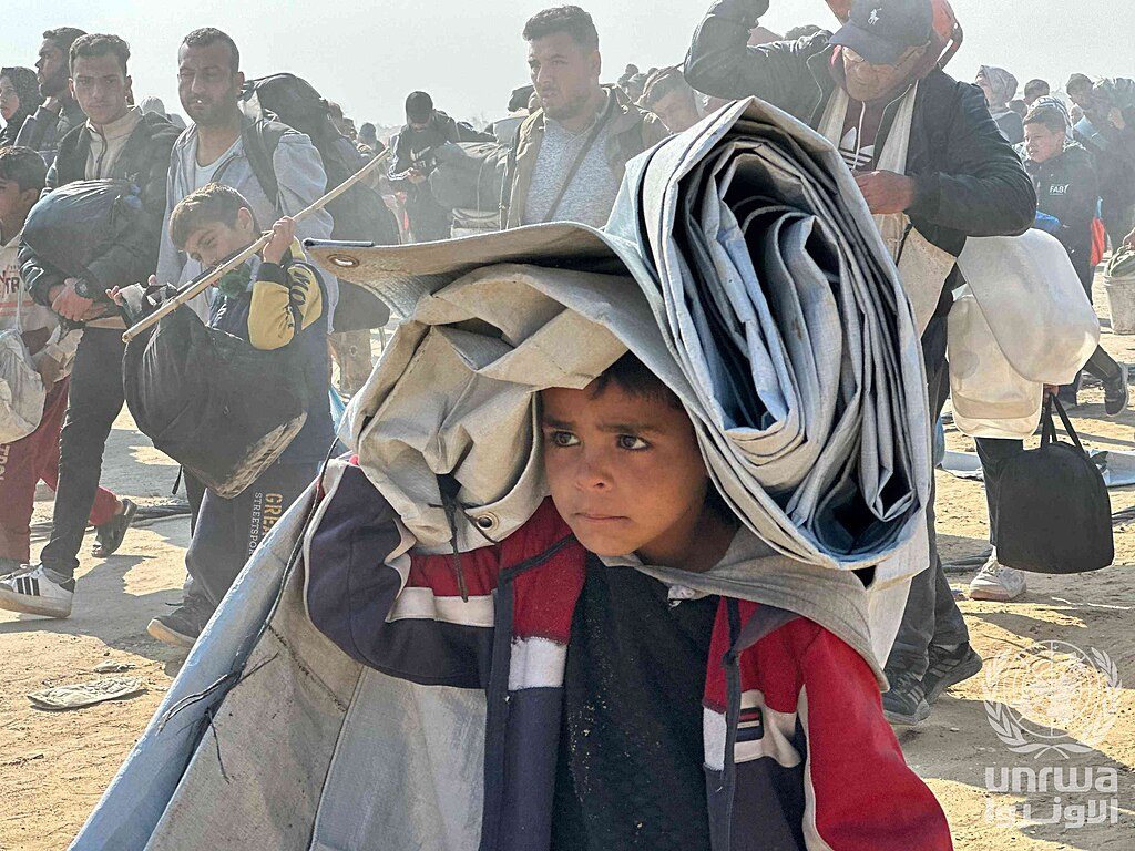 Gaza’s Reconstruction: Who Gets to Decide What Comes Back? 8 Displaced Palestinian families travelling along Al-Rasheed Street during the January 2025 ceasefire, carrying personal belongings